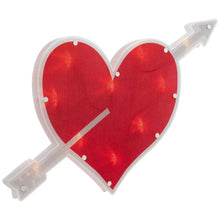 Red heart window silhouette with white border, crossed arrow arms, and LED lights