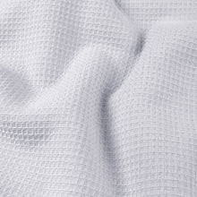 White waffle bath towel fabric, close-up textured weave