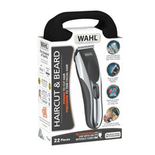 Black and silver beard and hair clipper with retail box packaging