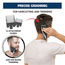 Beard trimmer in hand with attachment guides for precise grooming