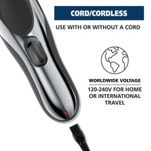 Cordless hair and beard trimmer with side switch and plug connection port