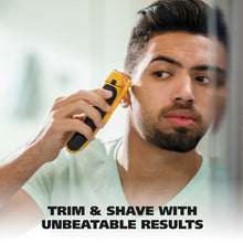 Electric foil shaver used on face, yellow and black wet/dry shaver