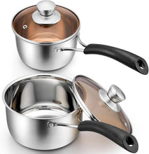Stainless saucepan set with glass lids and black handles; copper-toned interior