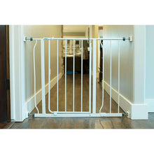 Baby safety gate installed in doorway with white wall-mounted connectors
