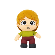 Shaggy plush toy with blonde hair, green shirt, maroon pants and dark shoes