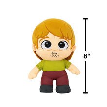 Shaggy plush toy with blonde hair, green shirt, maroon pants; 8" height