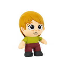 Shaggy plush toy face and torso with blonde hair, green shirt and maroon pants