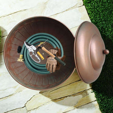 Garden water hose storage pot with open lid, coiled hose inside, and metal base hardware