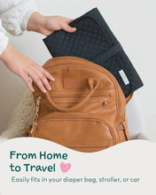 Brown zippered changing pad case with carry handle and stitched pocket