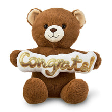 Tan teddy bear plush holding a white “Congrats” ribbon banner