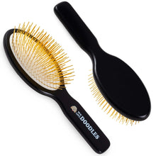 Black dog grooming pin brush with gold-tipped pins and ergonomic handle
