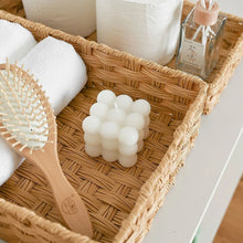 Rectangular rattan-style storage bin with open top and woven handle, tan