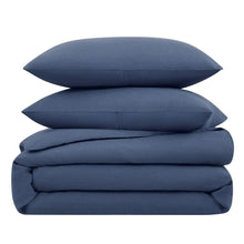 Folded blue cotton-linen duvet cover set with two pillow shams