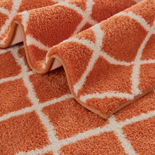 WelHome printed bath rug set, orange-and-white diamond shag pile, close-up