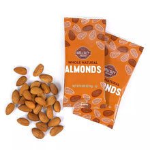 Whole natural almonds pouch with whole almonds scattered on surface