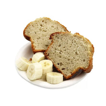 Banana muffin slices with banana pieces on white plate