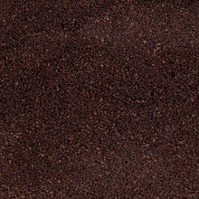 Dark ground coffee texture filling the frame