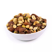 Bowl of salted roasted mixed nuts with almonds, pecans, walnuts, pistachios