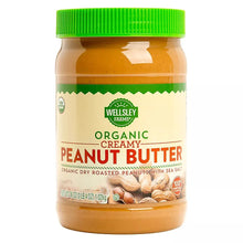Wellsley Farms organic creamy peanut butter jar with green lid and front label