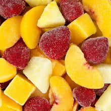 Frozen mixed fruit pieces, including yellow and red chunks with sugar coating