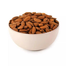 Raw almonds in white bowl