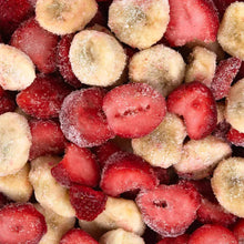 Frozen sliced strawberries and bananas, red and yellow fruit pieces coated with ice crystals