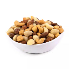 Salted roasted nut mix in white bowl with cashews, almonds, and macadamias