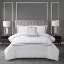 Comforter set with white comforter, gray striped border, and matching pillows