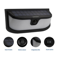 Solar LED motion-activated wall light with solar panel, white diffuser, and built-in motion sensor