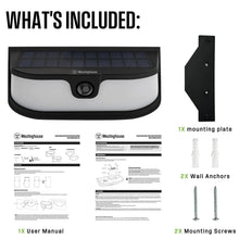 Solar LED wall light and included parts: mounting plate, anchors, screws, and user manual