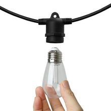 LED bulb socket and clear glass bulb with hand holding string light