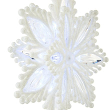 White LED snowflake tree topper close-up with frosted arms and glowing center