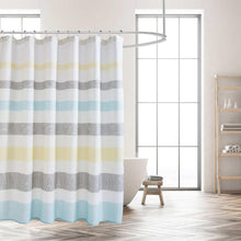 Striped shower curtain in blue, gray and yellow with white backing