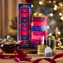 Whittard tea selection set with stacked boxes and wrapped tea bag sachets on a table
