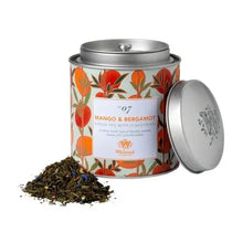 Metal tea tin with lid and loose tea leaves, labeled Mango & Bergamot