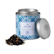 Metal tea tin with lid and loose tea leaves, labeled Earl Grey