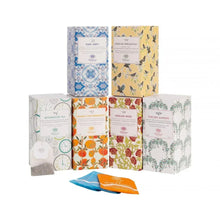 Tea bag collection multipack with assorted flavored tea sachets in patterned boxes