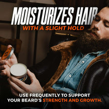 Beard balm on a bearded man, tin held near his chin