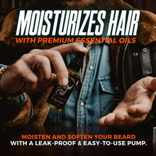 Beard oil bottle with pump in hand, next to denim jacket