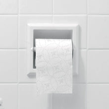 Bath tissue wall holder with white embossed sheets protruding