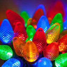 Multicolor C7 LED Christmas lights with green-wire bulbs, glowing in red, blue, green