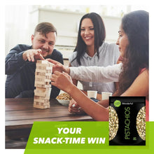 Roasted & salted pistachios pouch on a snack-time card near a playing game tower