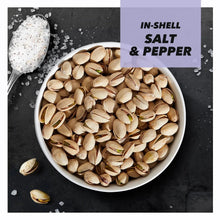 In-shell pistachios with salt and pepper seasoning in a white bowl
