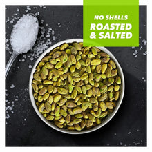 Bowl of roasted and salted pistachios with visible coarse salt and green kernels