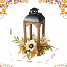 Wooden lantern with black roof and glass, framed by daisy and autumn foliage