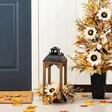 Wooden lantern with black metal top and glass, with fall daisy and greenery accents