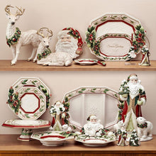 Deer figurines set: standing deer and lying deer, both with green berry wreaths.