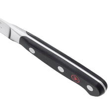 Wusthof Classic chef knife handle with oval rivets and red emblem