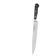 Chef knife with stainless blade and black handle with rivets