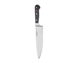 Chef knife with curved stainless blade and black handle with rivets